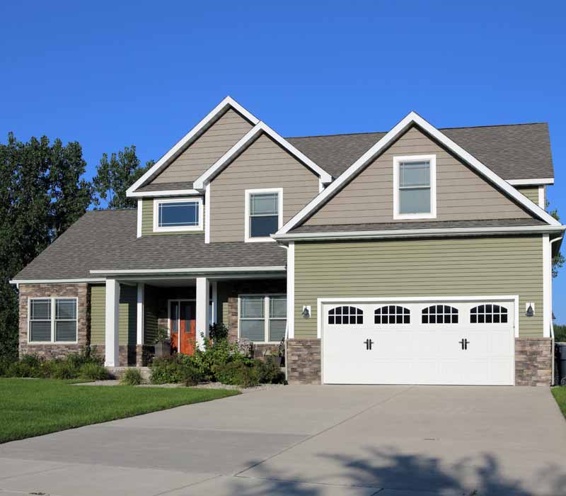 Green/gray siding home front lawn view